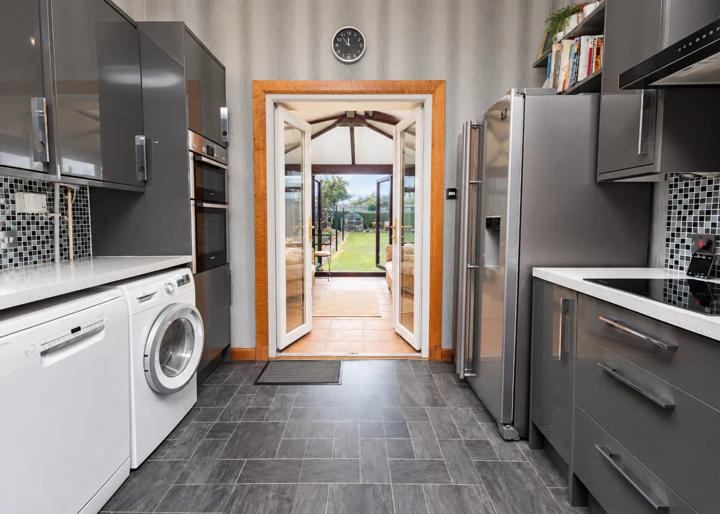 Kitchen opening into the conservatory and garden at 118 Craigentinny Road, Edinburgh.
