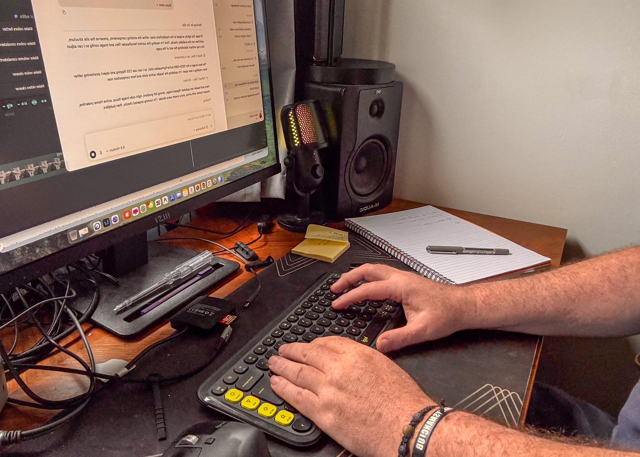Hands typing on a keyboard during Bear Media content planning and creation