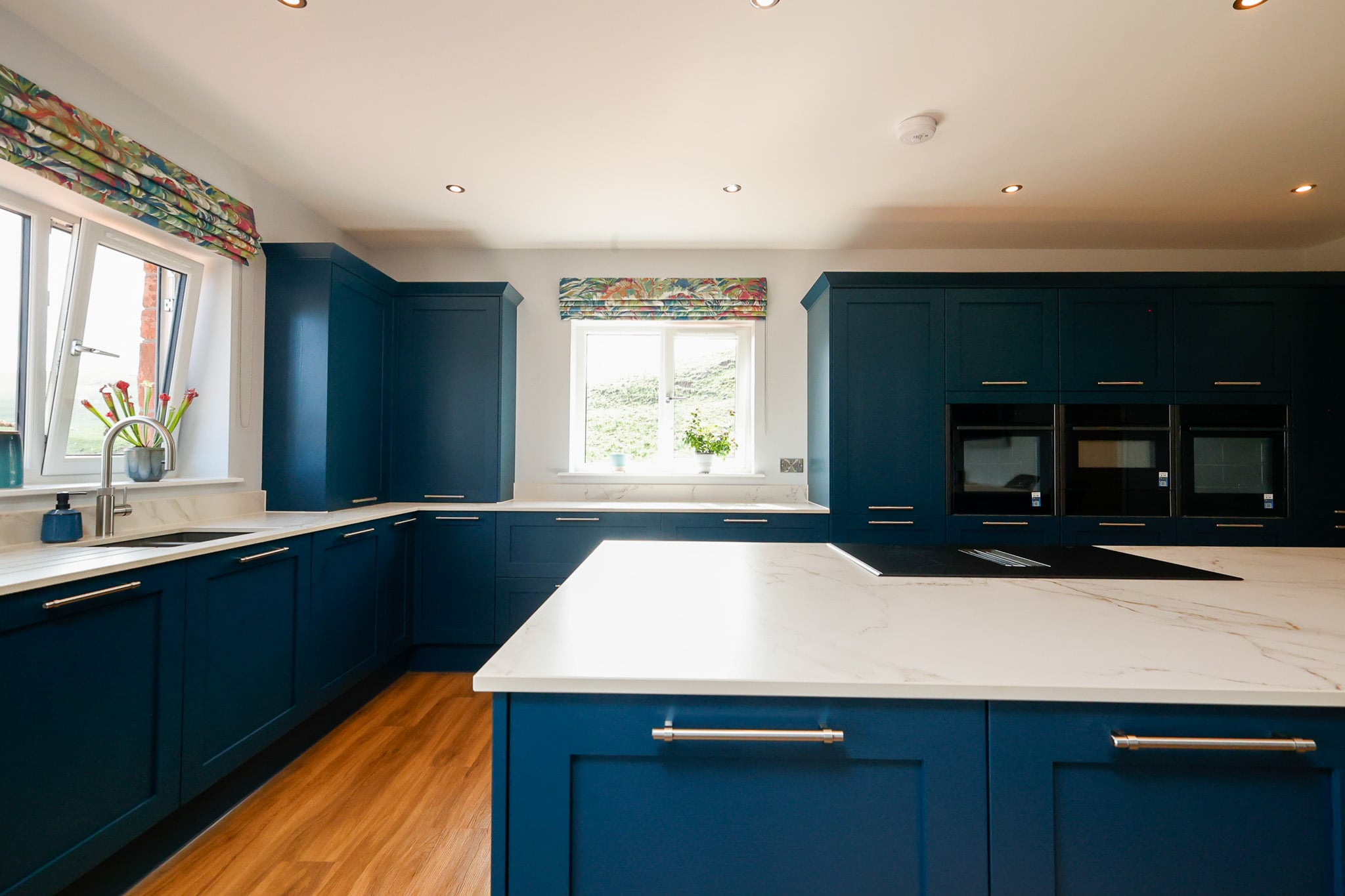 Finished dark green kitchen and island photographed for C&G Developments