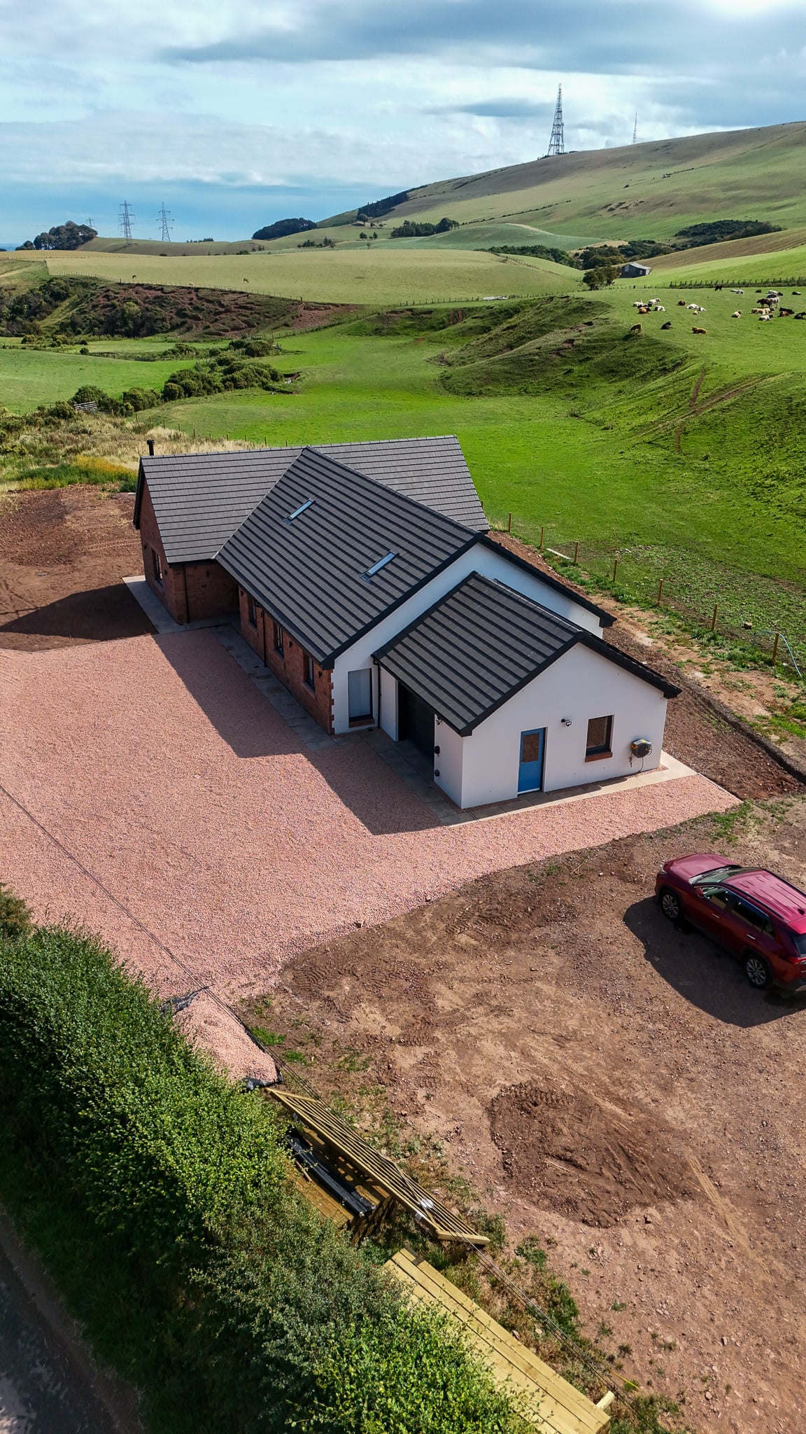 Drone view of a finished C&G Developments home in its rural setting