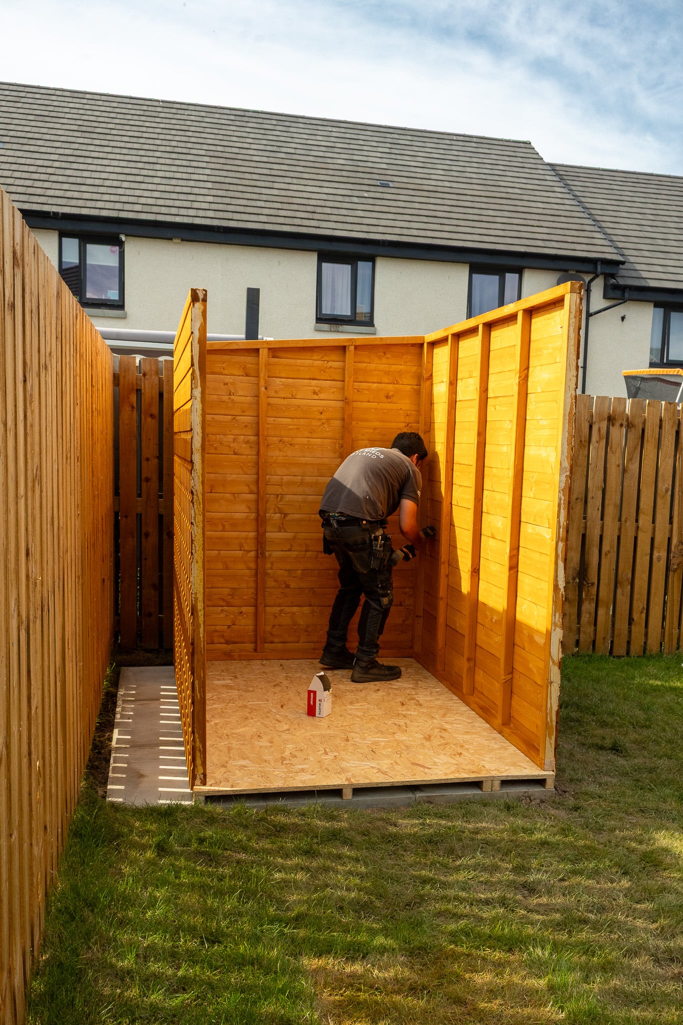 Simply Sheds Scotland team assembling a garden building on site