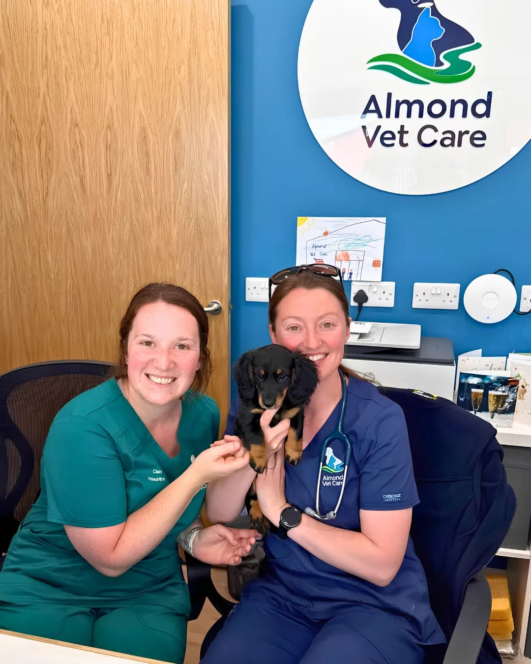 Almond Vet Care team with a puppy at the practice