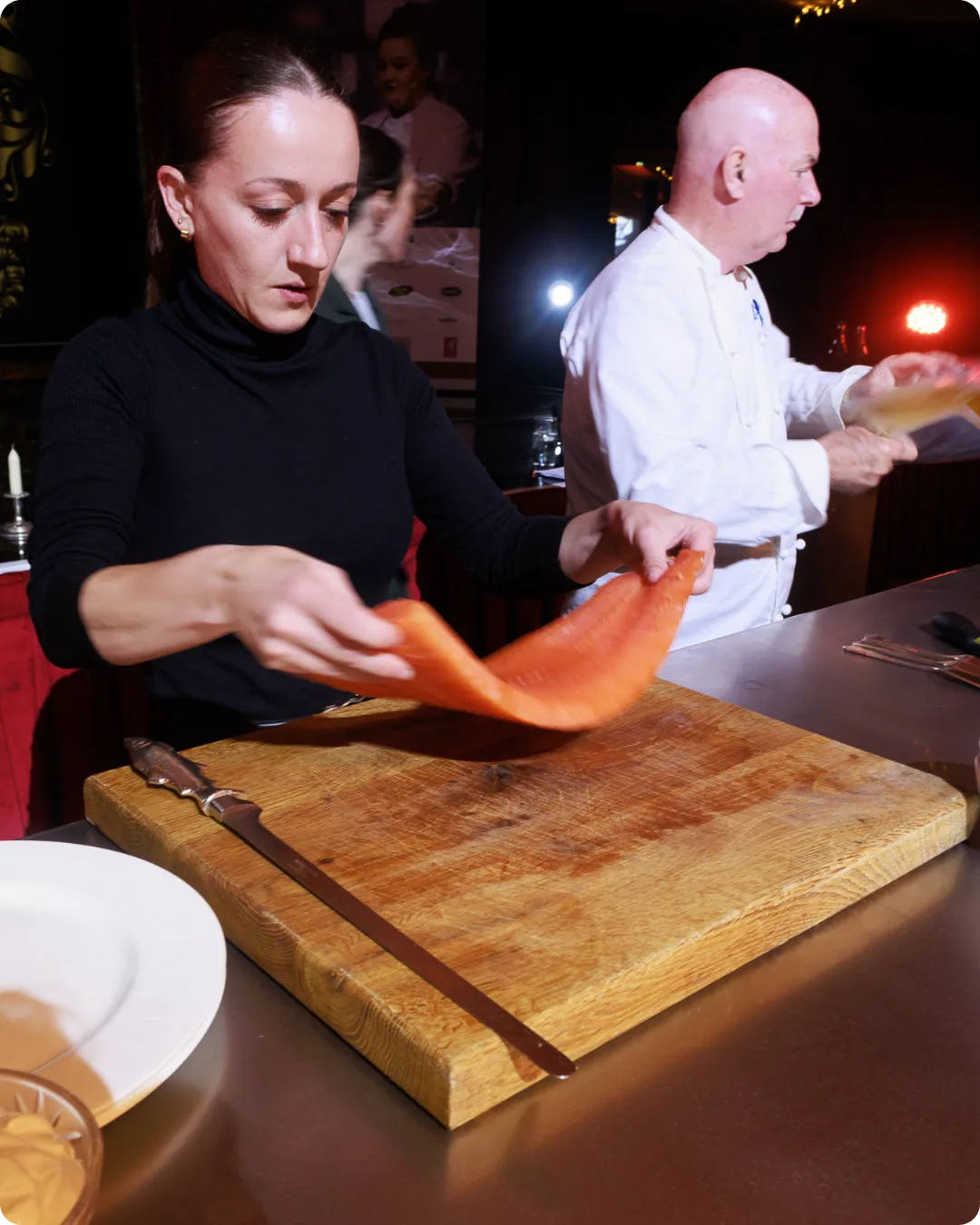 Chef preparing food during a hospitality event photographed by Bear Media